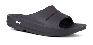 Oofos footwear are designed to provide support and cushion to people with plantar fasciitis and foot pain. The Oofos slide pictured is the most popular model.