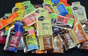 Energy gels are a source of carbohydrates to give marathon runners energy when glycogen stores are depleted. Gu is a brand of energy gel.