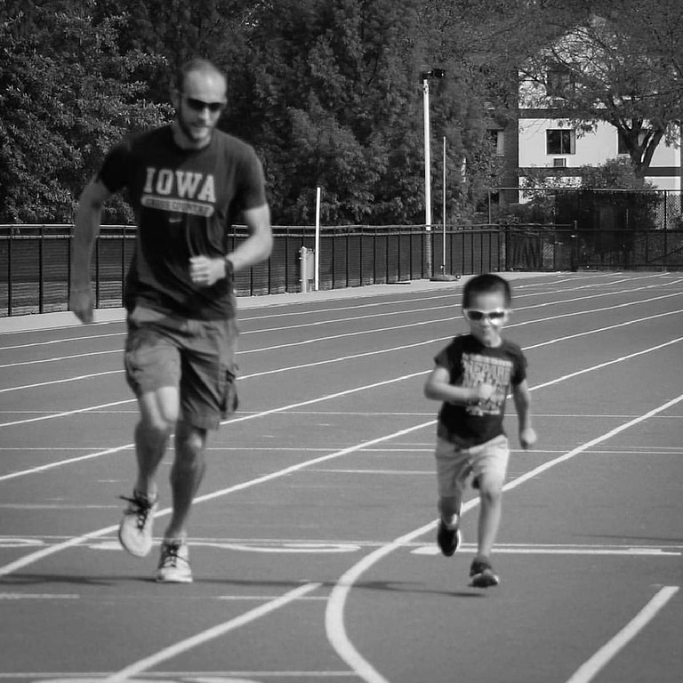 running coach on a track
