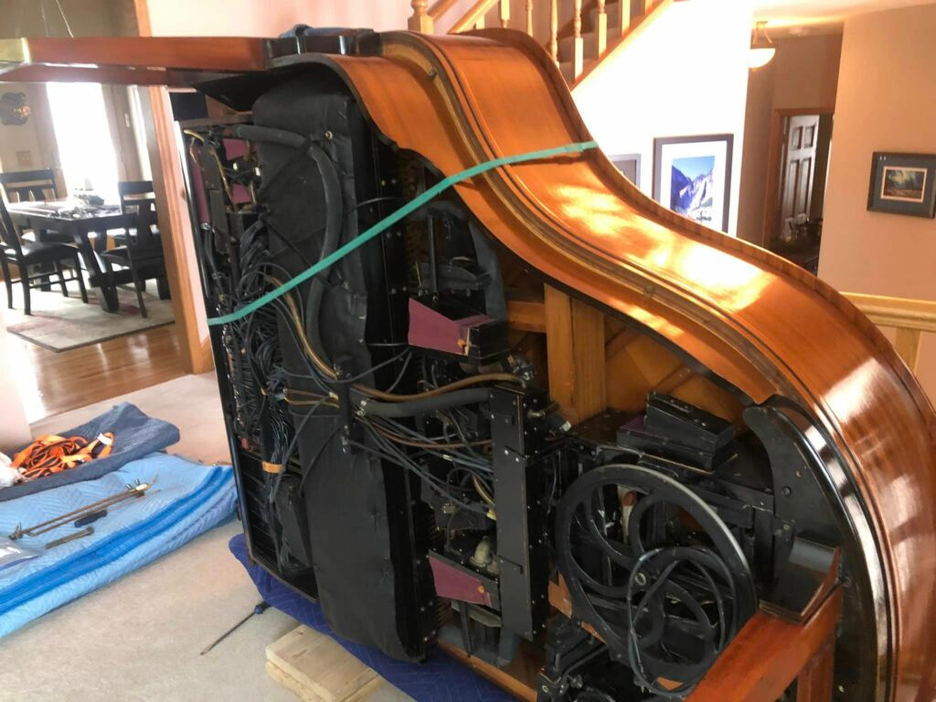 piano on its side, ready to be moved