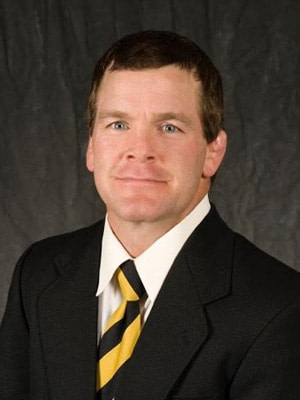 Terry Brands wearing a suit and tie