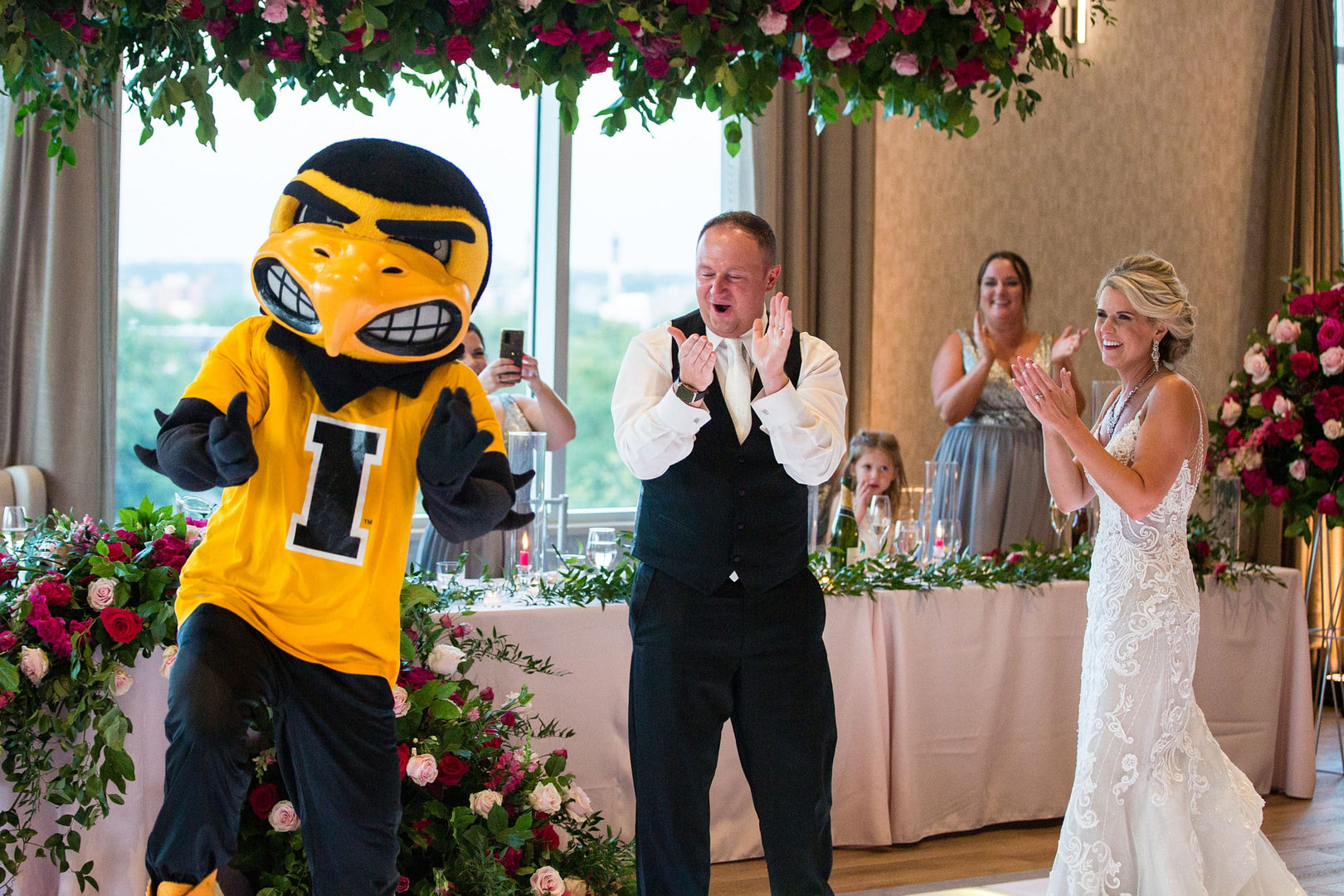 a couple of people that are standing in a wedding dress