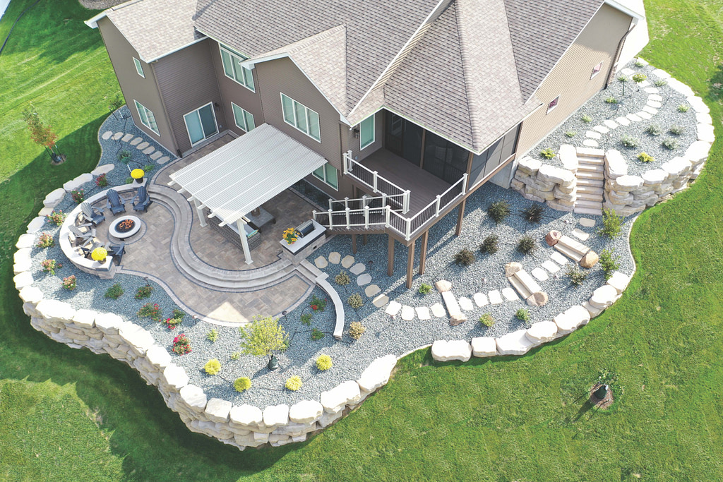Aerial View of attached pergola to a nicely landscaped home