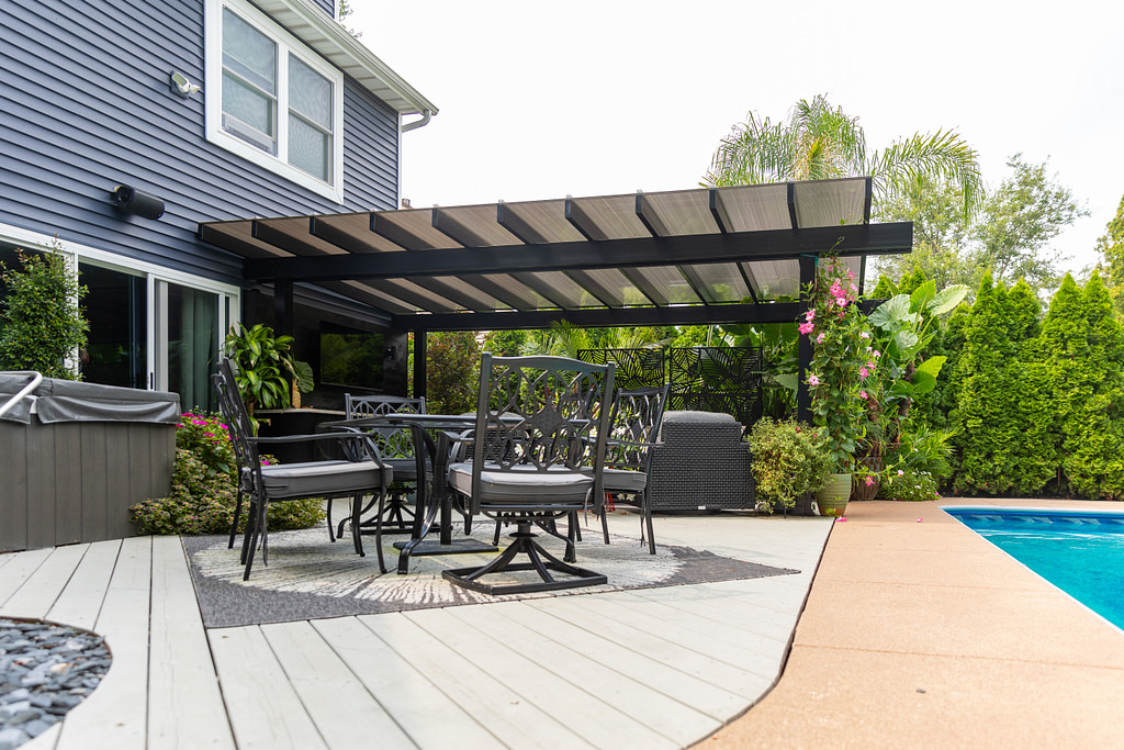 Black covered pergola over a patio