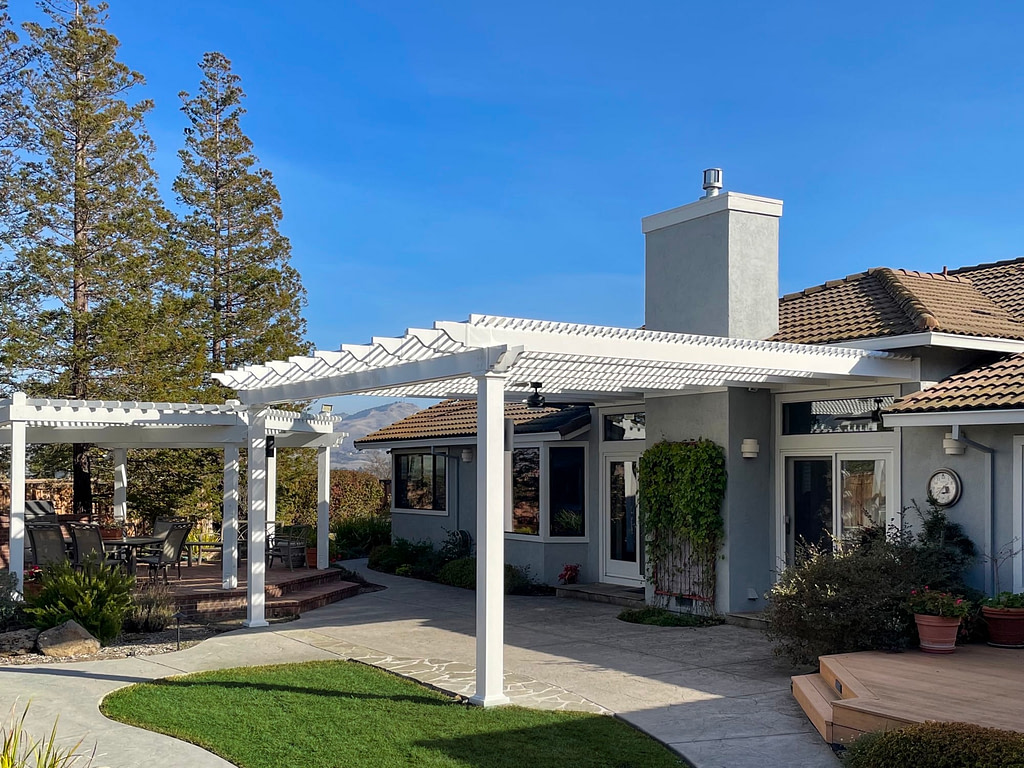 Custom tall pergola attached to California home with mountains in the distance