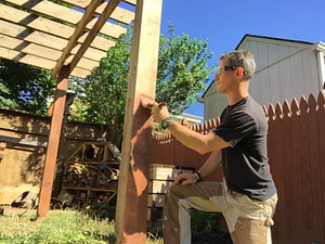 staining a wood pergola