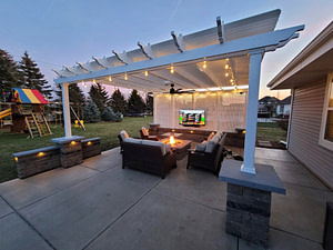 Outdoor patio pergola with string lights, outdoor fan and tv mount with seating area and outdoor fire table