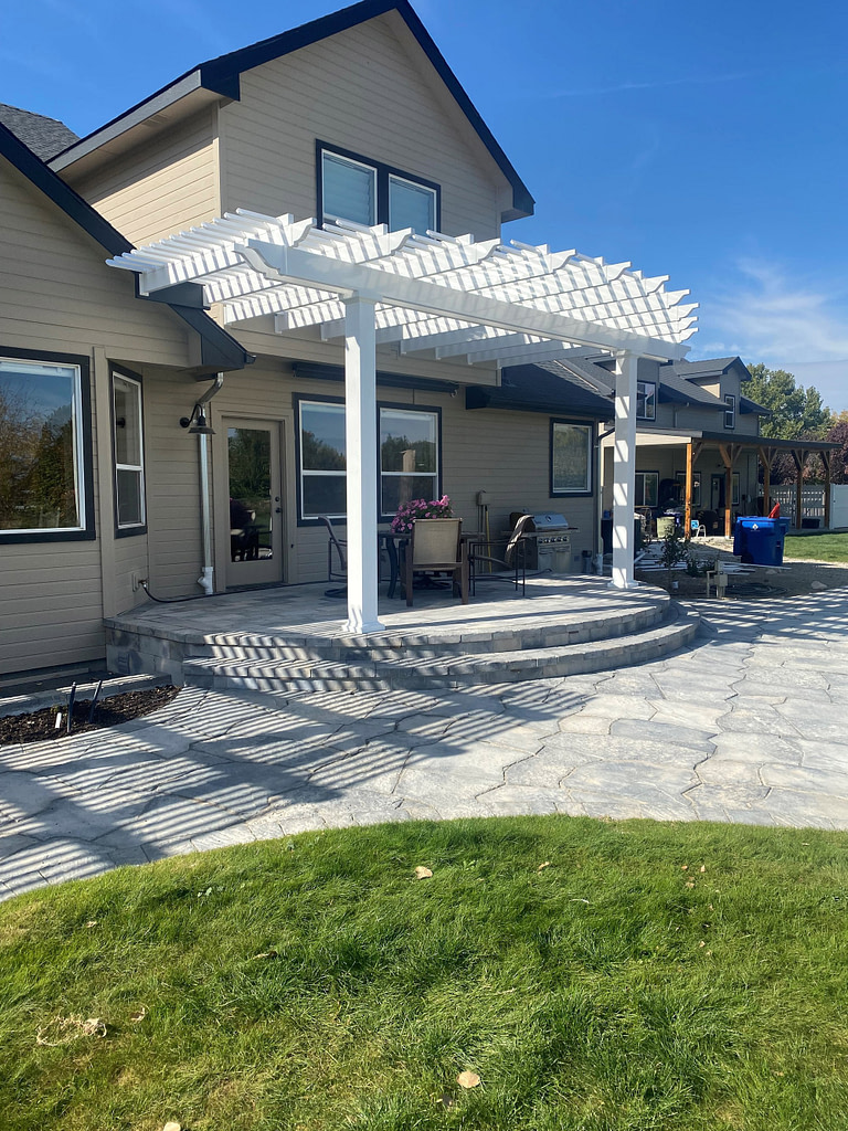 rounded pergola over a rounded patio