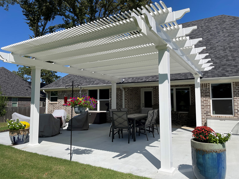 Texas shade pergola over a patio in a backyard. DIY pergola kit