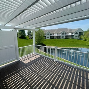 shade pattern created under a white pergola with 75% shade and side vinyl privacy wall
