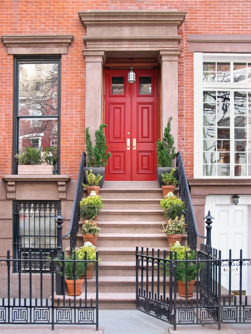 Townhouse Entrance With Ornate Railings And Gate