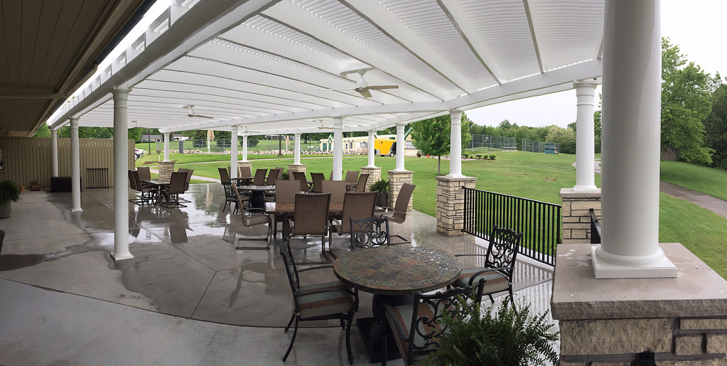 Outdoor country club patio with overhead pergola