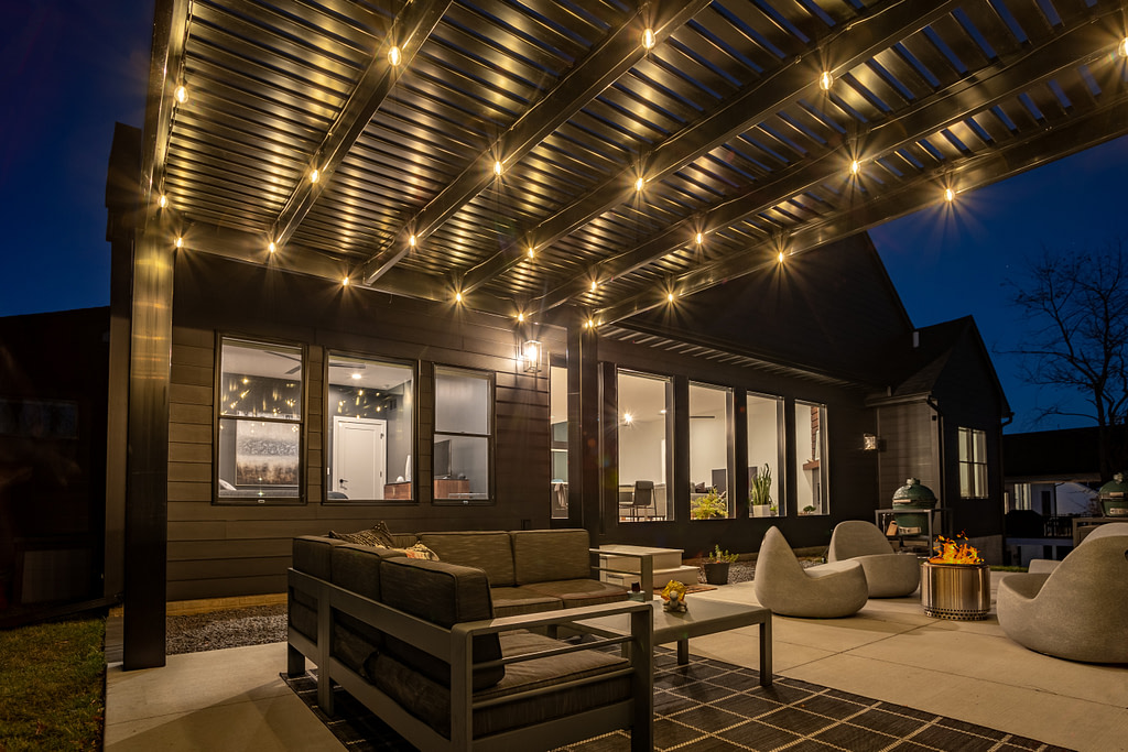 black modern vinyl pergola with string lights