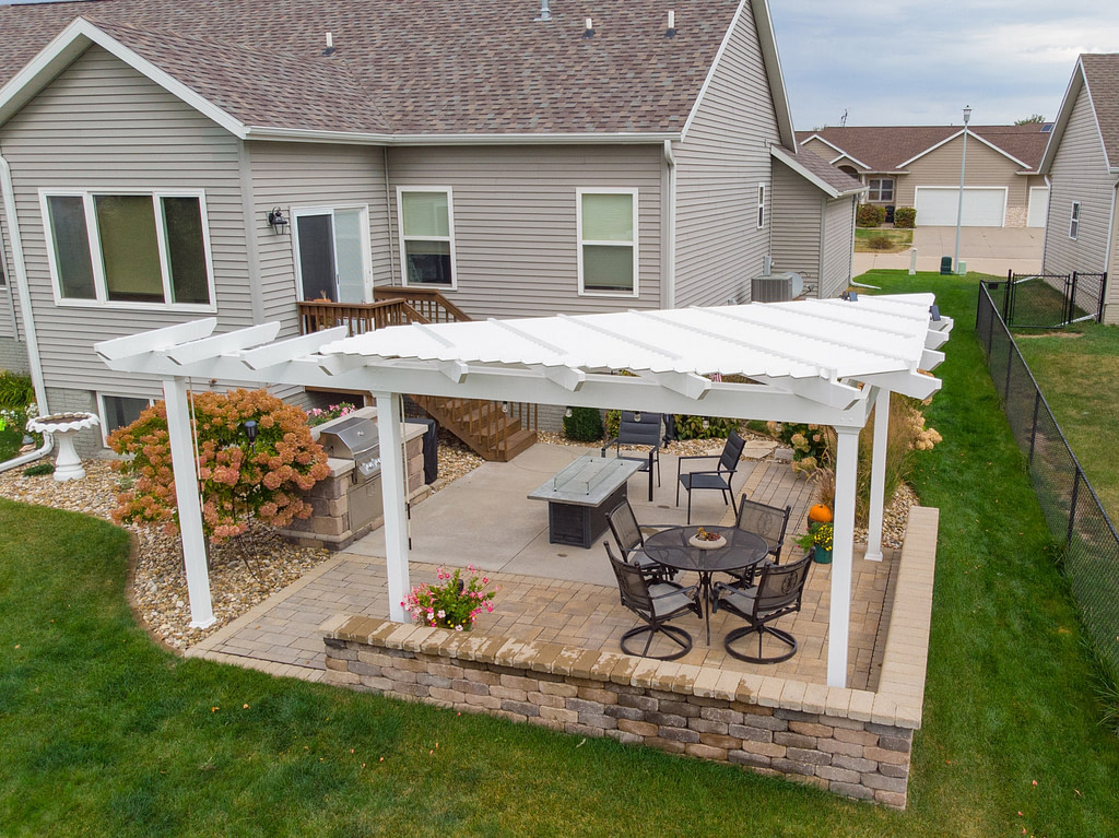 Overhead view of a triangle pergola with custom arbor on a corner of a patio