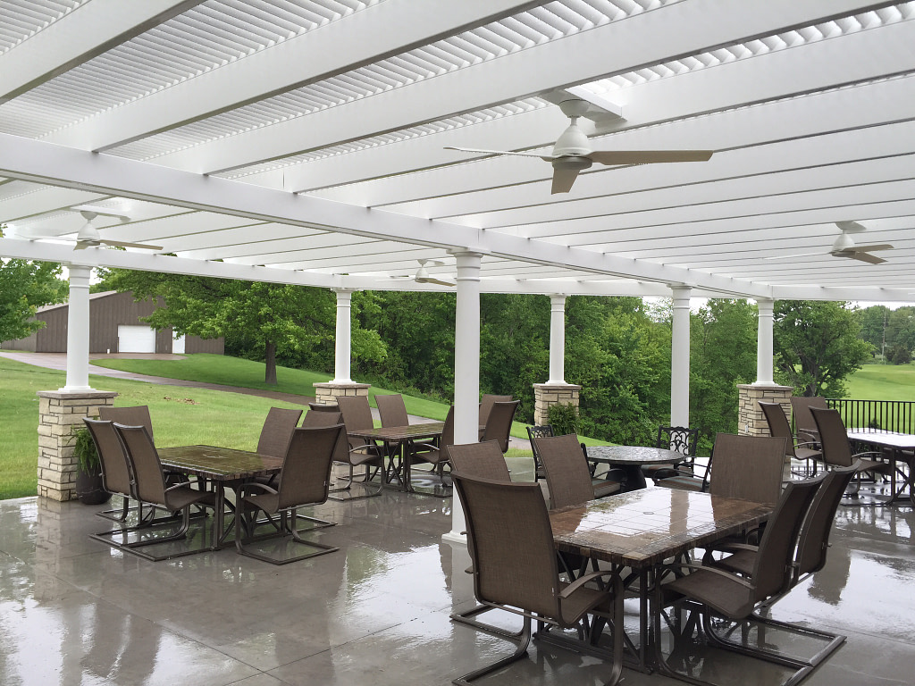 Country club patio with pergola overhead - rounded column post