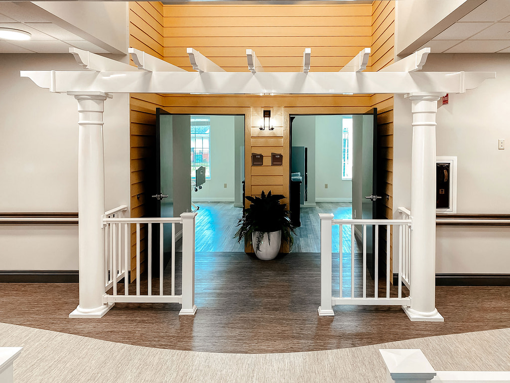 Indoor pergola structure at an indoor living facility