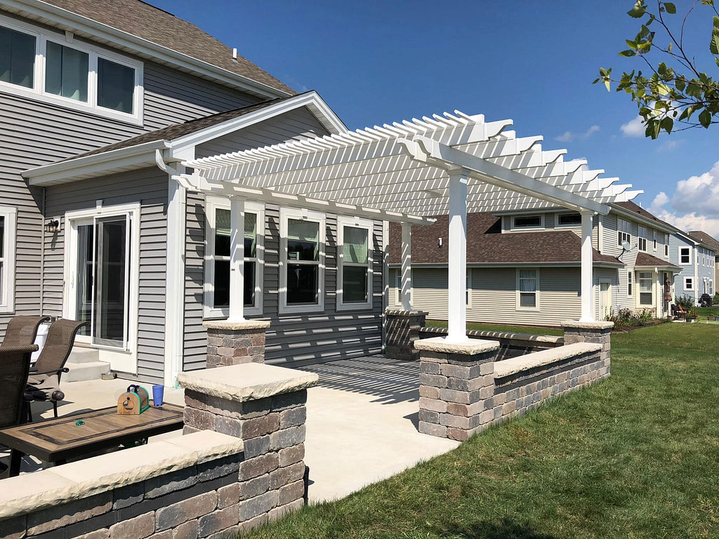 traditional shade pergola over a concrete patio