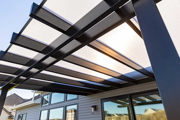 Close up of the underside of a rain proof pergola with polycarbonate roof