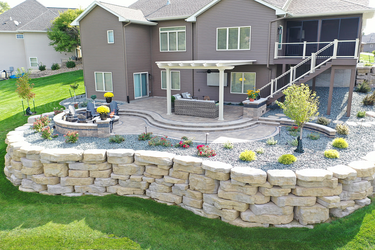 beautifully landscaped patio with attached pergola