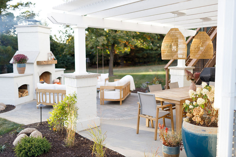 vinyl pergola on landscape stone column and fireplace