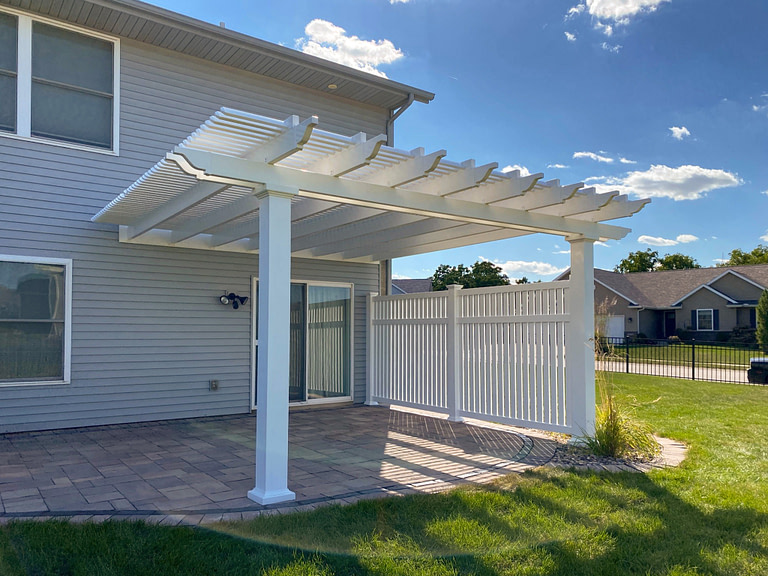 Patio shade pergola with vinyl fence panel privacy wall