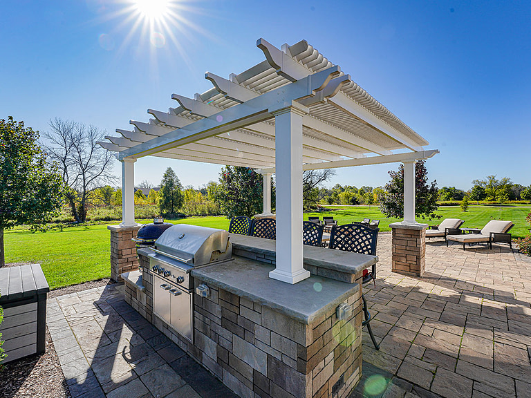 outdoor kitchen pergola on stone columns