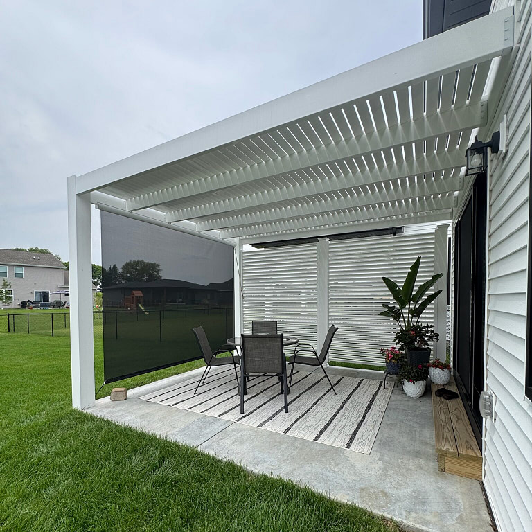 Attached modern pergola with pulldown sunshade and privacy screen