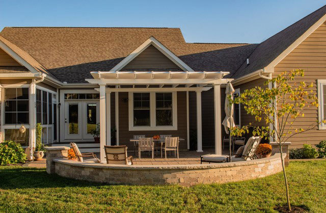 Sunset on a home with a freestanding pergola on their back patio