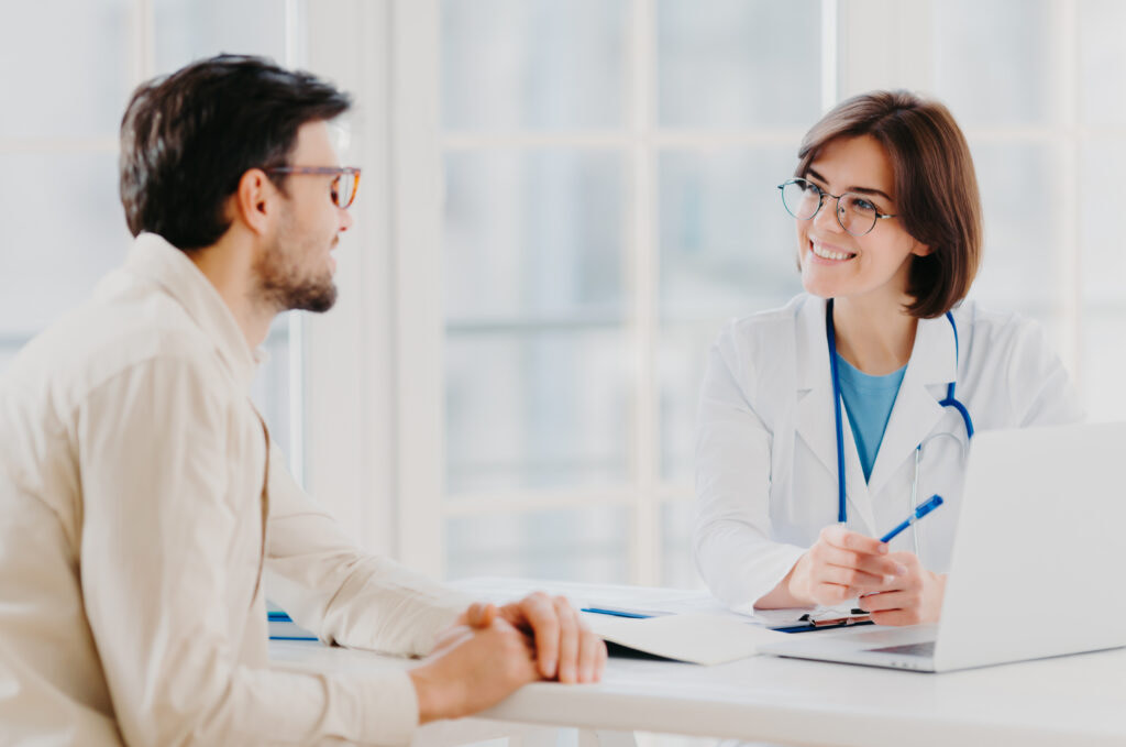 Attentive Female Doctor Explains Diagnosis To Patient
