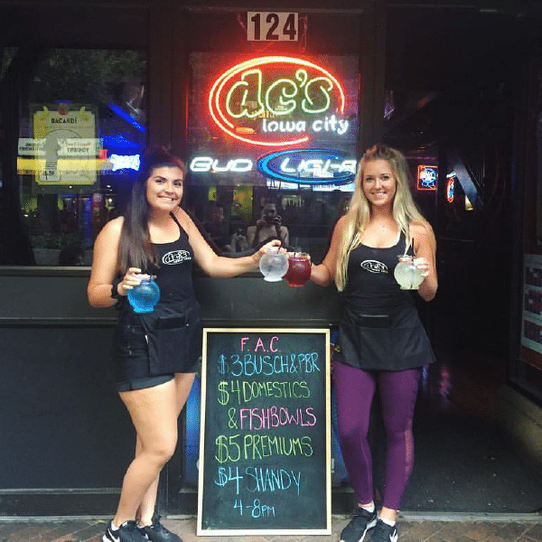 a group of people standing in front of a store