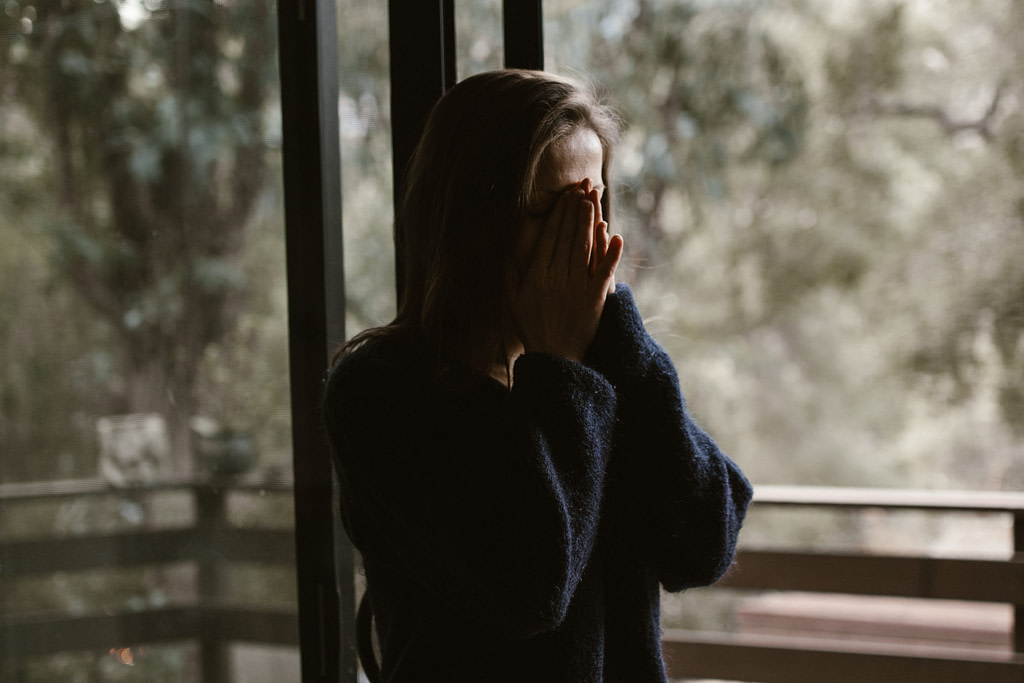 a person standing in front of a window