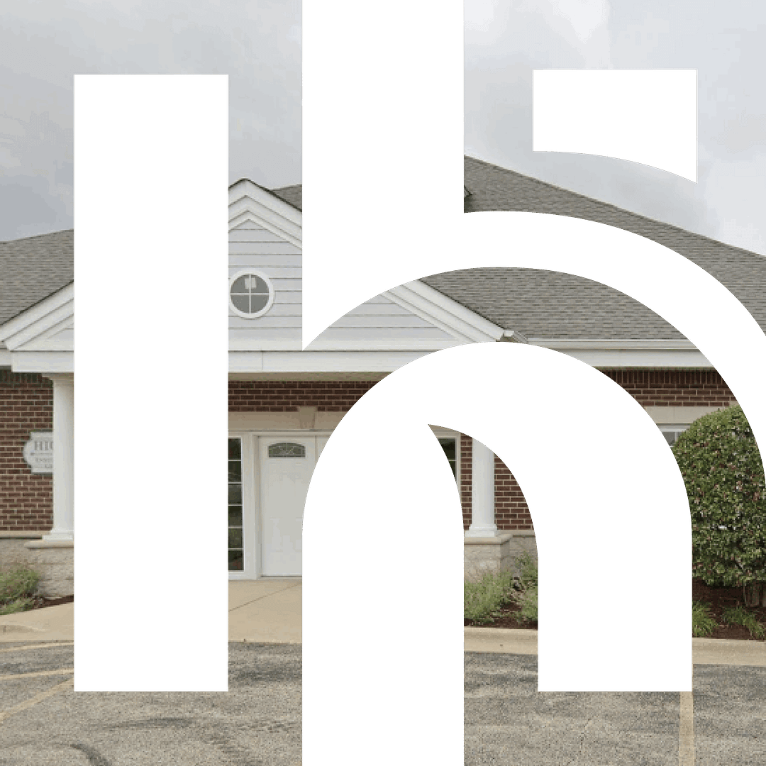 Building facade obscured by large black shapes