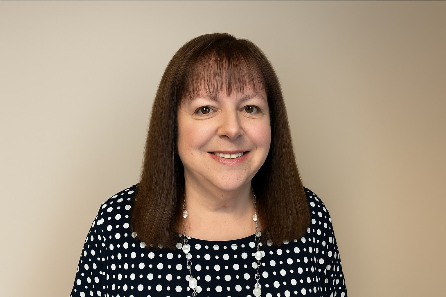 Woman in polka dot top smiling