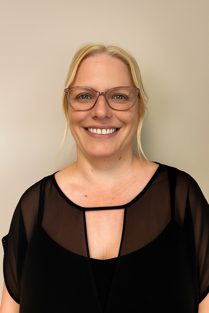 Smiling woman in glasses wearing black blouse