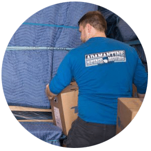 mover moving box out from moving truck
